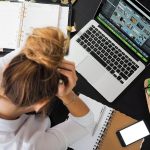 stressed woman writing resignation letter